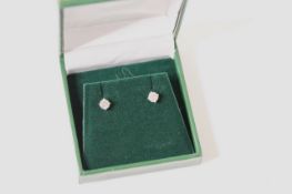 Pair of 18ct white gold RBC diamond solitaire studs, boxed. Diamonds 1.11ct