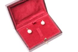Pair of 9ct yellow gold drop studs with suspended pinkish freshwater pearls, boxed