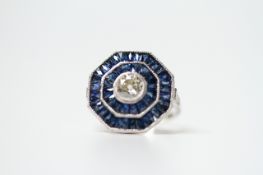 Platinum octagonal sapphire and diamond ring set with a central old-cut diamond of 0.65ct approx,