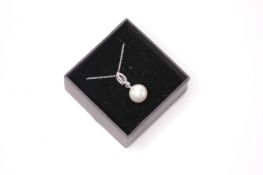 9ct white gold pearl and diamond necklace, boxed. Diamonds 0.06ct