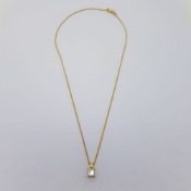 Approximate 1 carat princess cut diamond in a yellow gold pendant on an 18 carat yellow gold chain
