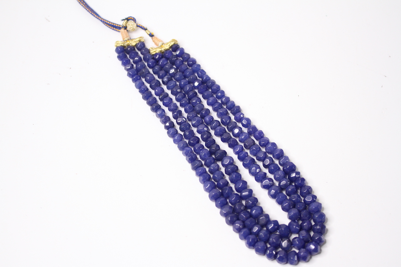 Earth-mined faceted round sapphire bead necklace with adjustable slip knot, cord and tassle.