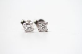 Fine quality pair of 18ct white gold princess-cut diamond solitaire studs, boxed. Diamonds 0.