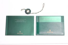 ROLEX SUBMARINER BOOKLETS, WALLET AND SWING TAG, Rolex Submariner operating booklet, printed in