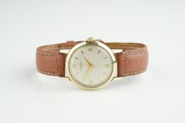 GENTLEMENS J.W. BENSON 9CT GOLD WRISTWATCH, circular off white dial with gold hour markers and