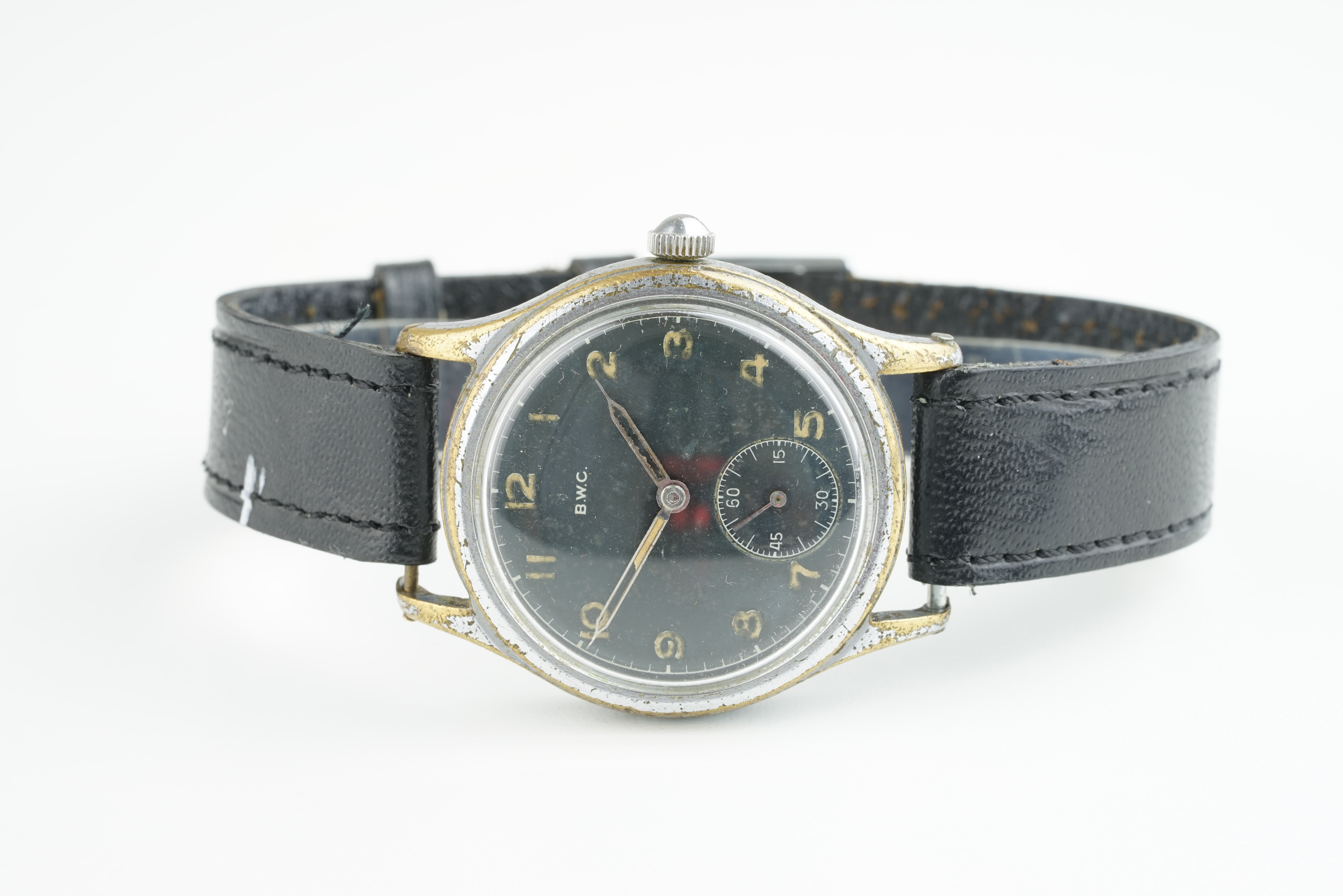 GENTLEMENS B.W.C. GERMAN MILITARY WRISTWATCH, circular black dial with hour markers and hands,