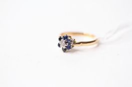 Sapphire & Diamond Flower Ring, stamped 18ct yellow gold, size K, 2.65g.