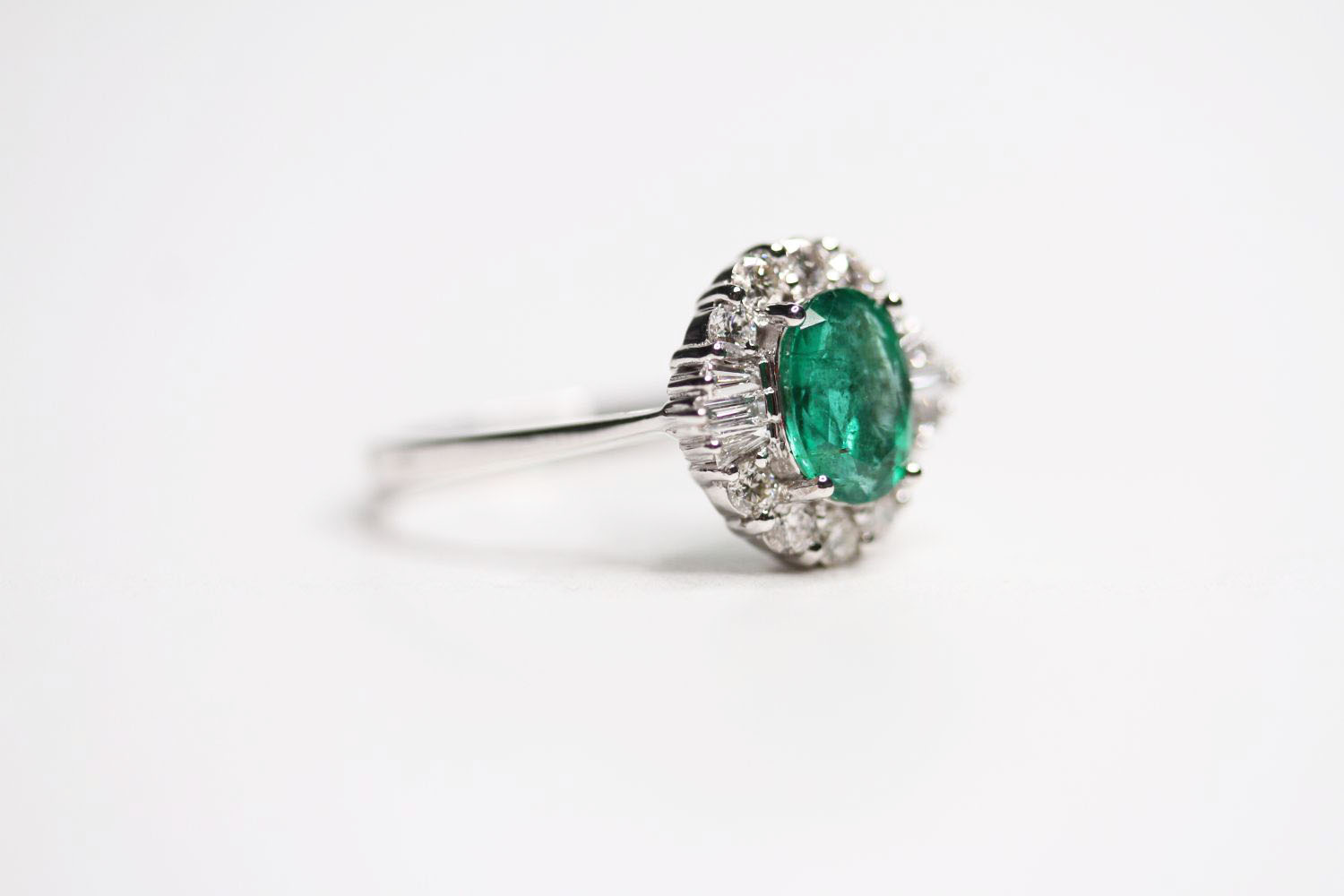 18ct white gold oval emerald and diamond cluster ring. Emerald 1.20ct. RBC and tapered baguette - Image 2 of 3
