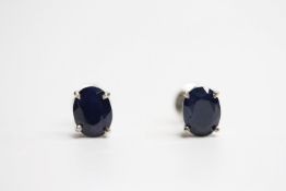 Pair of treated sapphire silver studs