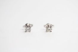 Pair of 18ct white gold claw-set RBC diamond solitaire studs, boxed. Diamonds 0.46ct