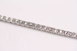 Diamond Line Bracelet, 18ct white gold, 57 diamonds totalling approximately 5.12ct total, 2 d clips,