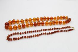 2 x 9ct gold clasp amber necklaces inc. baltic, individually knotted (47g)