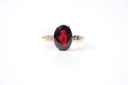 Garnet & Diamond Ring, set with an oval cut garnet, claw set, 18ct yellow gold, size M1/2, 3.4g.