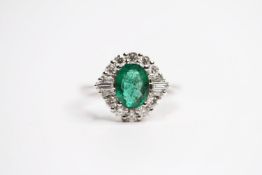 18ct white gold oval emerald and diamond cluster ring. Emerald 1.20ct. RBC and tapered baguette