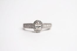 Vera Wang Oval Halo Diamond Ring, detailed diamond shoulders, sapphire set under collect, total