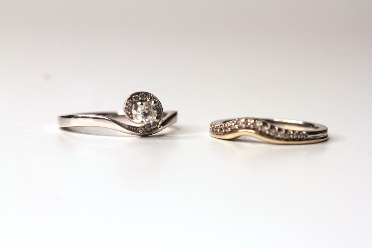 2 x Diamond Rings, ring 1 set with a round brilliant cut diamond, 4 claw set, surrounded by 11 round