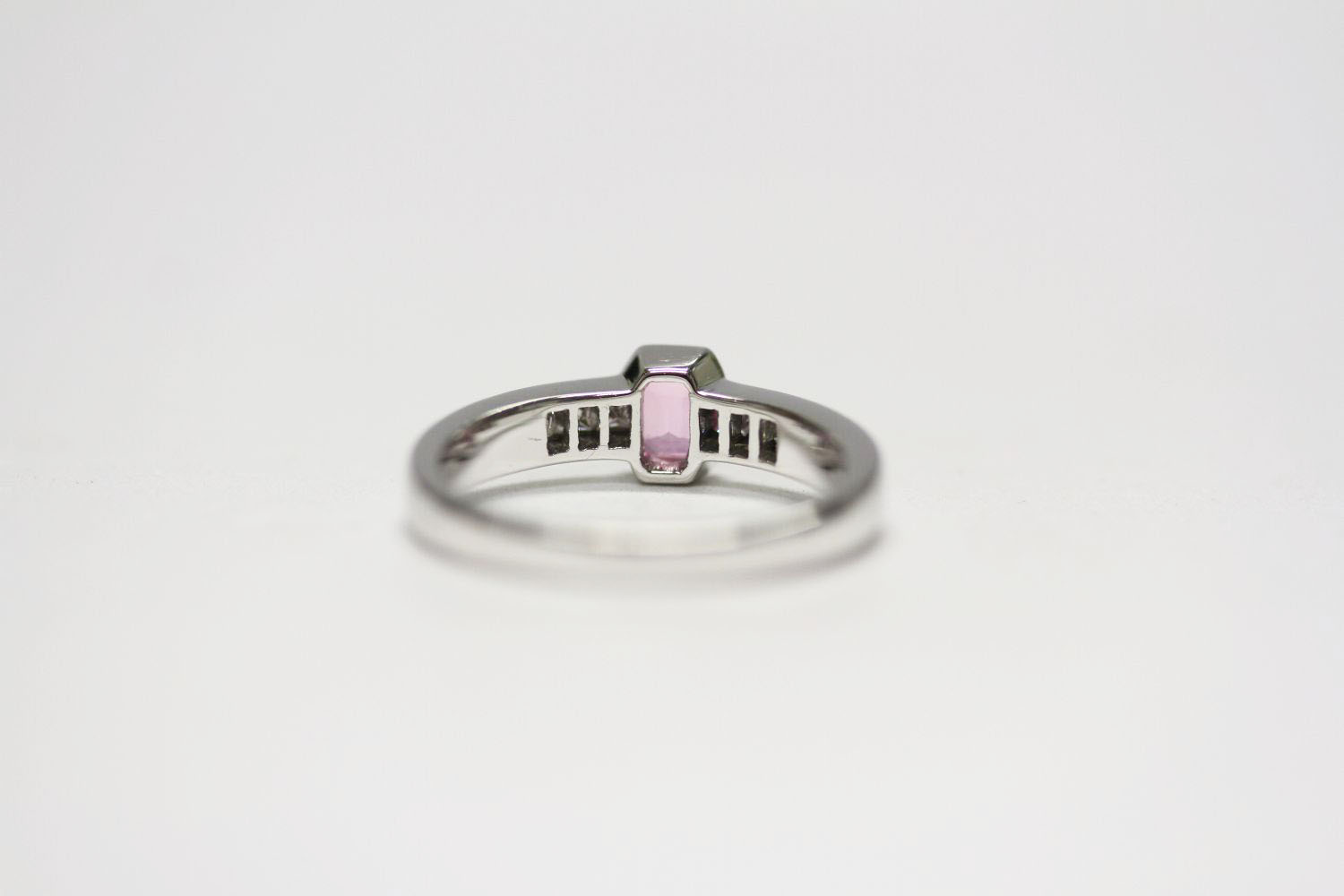 18ct white gold semi-rubover-set pink sapphire and channel-set diamond ring. Emerald-cut pink - Image 3 of 3