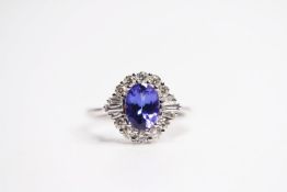 18ct white gold oval tanzanite and diamond cluster ring. Tanzanite 1.34ct. Diamonds 0.57ct (RBC 0.