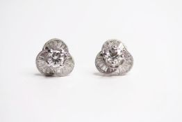 Pair of Baguette Cut Diamond Flower Earrings, central 4 claw set brilliant cut diamonds, total