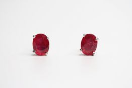 Pair of treated ruby silver studs.