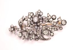 Diamond Flower Brooch, set with old cut diamonds, silver and gold, approximately 7 x 3.5cm.