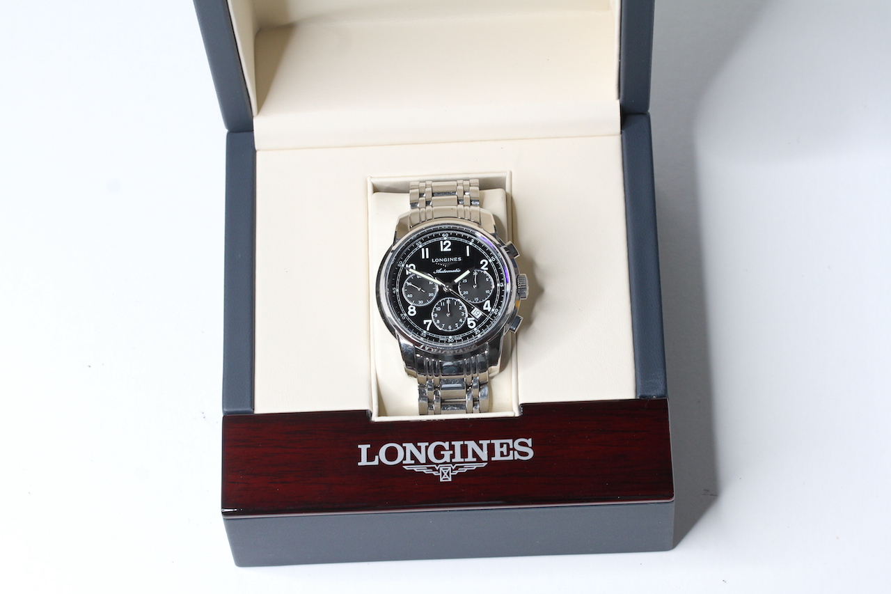 LONGINES AUTOMATIC CHRONOGRAPH WITH BOX, circular black dial with arabic numeral hour markers,