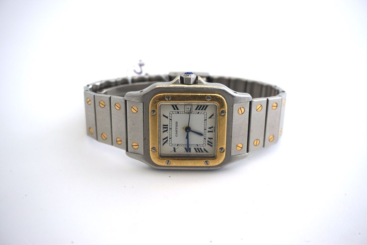 CARTIER SANTOS AUTOMATIC WRISTWATCH, square white dial, Roman numerals, gold bezel, 31mm stainless