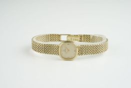 LADIES OMEGA 9CT GOLD COCKTAIL WATCH, rounded gold dial with hour markers and hands, 18mm 9ct gold