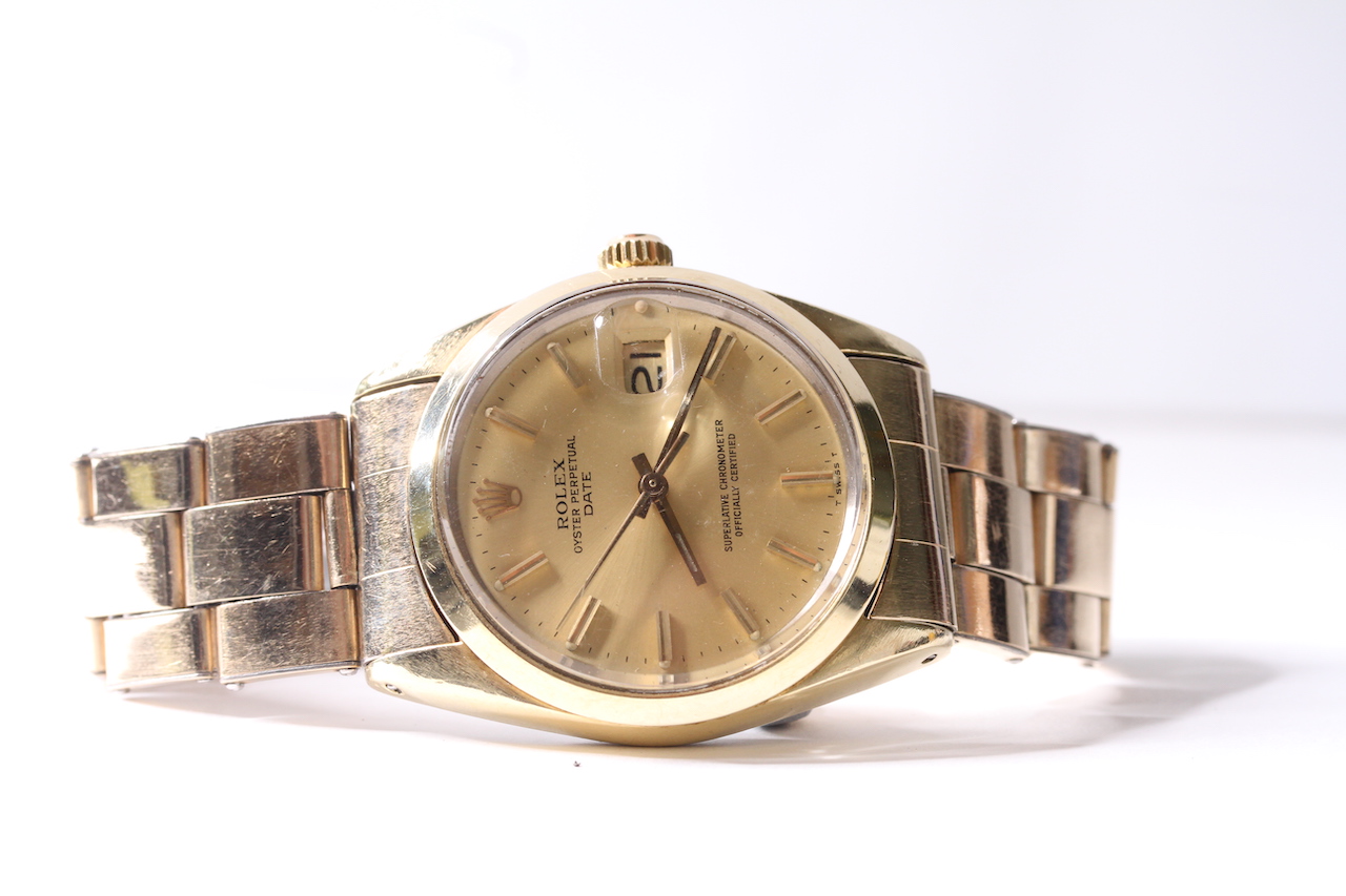 ROLEX OYSTER PERPETUAL DATE GOLD PLATED WATCH CIRCA 1980 REFERENCE 1550, circular champagne dial