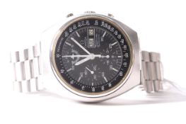 VINTAGE OMEGA SPEEDMASTER AUTOMATIC DAY DATE CIRCA 1984, circular black dial with baton and arabic