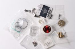 A collection of watch parts including Rolex, glasses, end links,date wheels, serile diamond dot