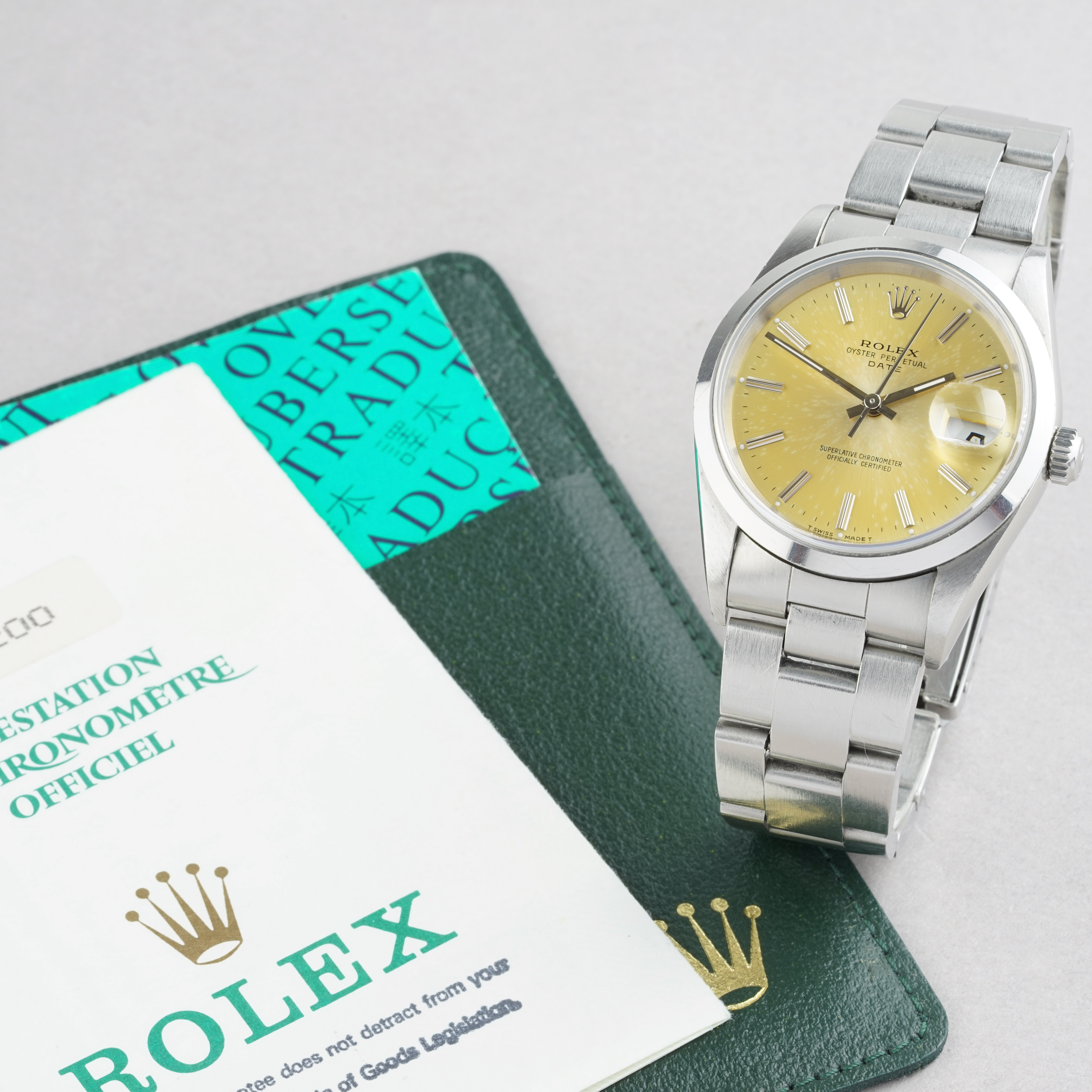 GENTLEMENS ROLEX OYSTER PERPETUAL DATE QUICKSET PATINA DIAL WRISTWATCH W/ GUARANTEE REF. 15200 CIRCA