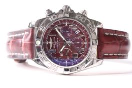 BREITLING CHRONOMAT 44 WITH BOX REFERENCE AB0110, circular burgundy dial with roman numeral hour