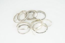 GROUP OF 15 STERLING SILVER BANGLES, 15 bangles, cuffs, some adjustable, approx. weight 158g. (30)