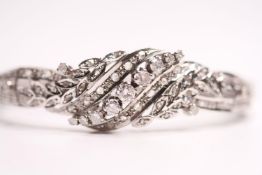 Diamond Bracelet, with detailed raised centre, 18ct white gold, approximately 25g and 17cm.