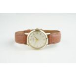 GENTLEMENS J.W. BENSON 9CT GOLD WRISTWATCH, circular off white dial with gold hour markers and