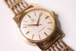 1950s 9CT OMEGA SEAMASTER WRIST WATCH, circular cream dial with baton hour markers, 34mm 9ct gold