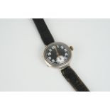 ANTIQUE WWI STERLING SILVER TRENCH WRISTWATCH, circular black dial with arabic numerals and hands,