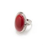 A RARE PLATINUM CORAL DIAMOND RING