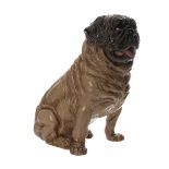 A CERAMIC PUG DOG FIGURE