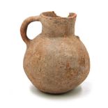 AN EARLY EARTHENWARE JAR