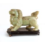 CARVED JADE FIGURE OF FOO LION WITH WOOD STAND