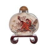 A CHINESE RESERVE PAINTED GLASS SNUFF BOTTLE