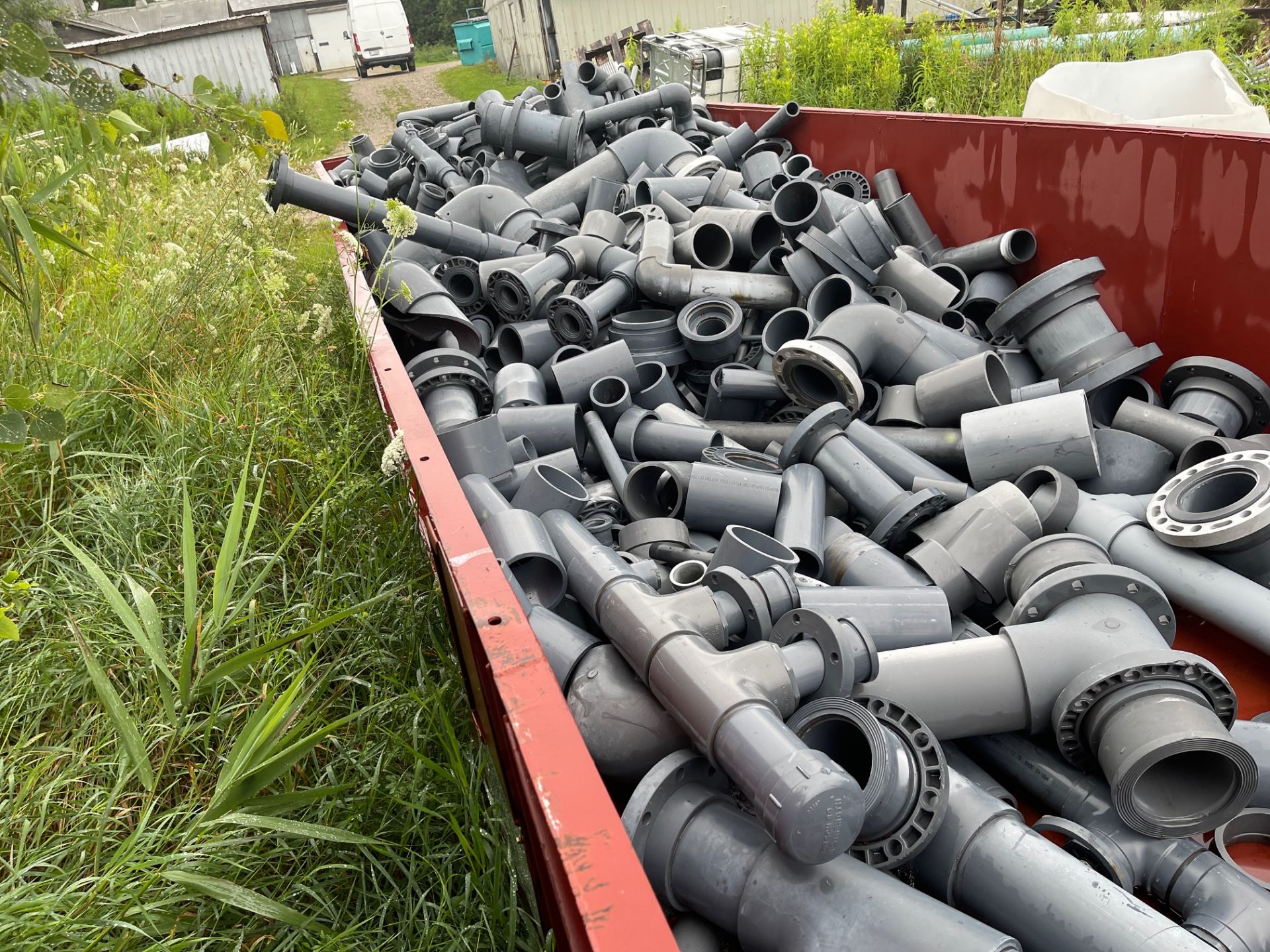 LOT OF STEEL BIN OF PVC CUT OFF AND SCRAP PIPE ALL THE SAME MATERIAL, 36"X90"X25", FULL BIN WILL FIT