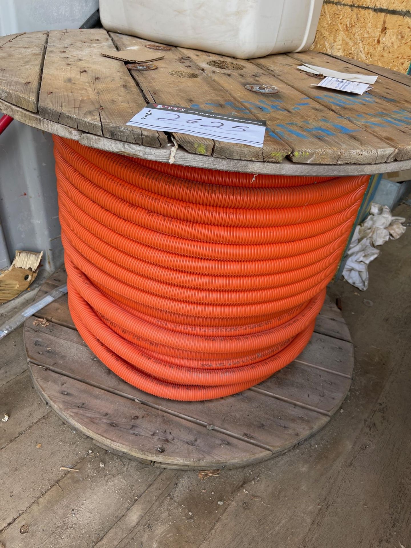 LOT/ CORRUGATED ORANGE PLASTIC TUBING, PLASTIC 1” ID, APPROX 500 FEET