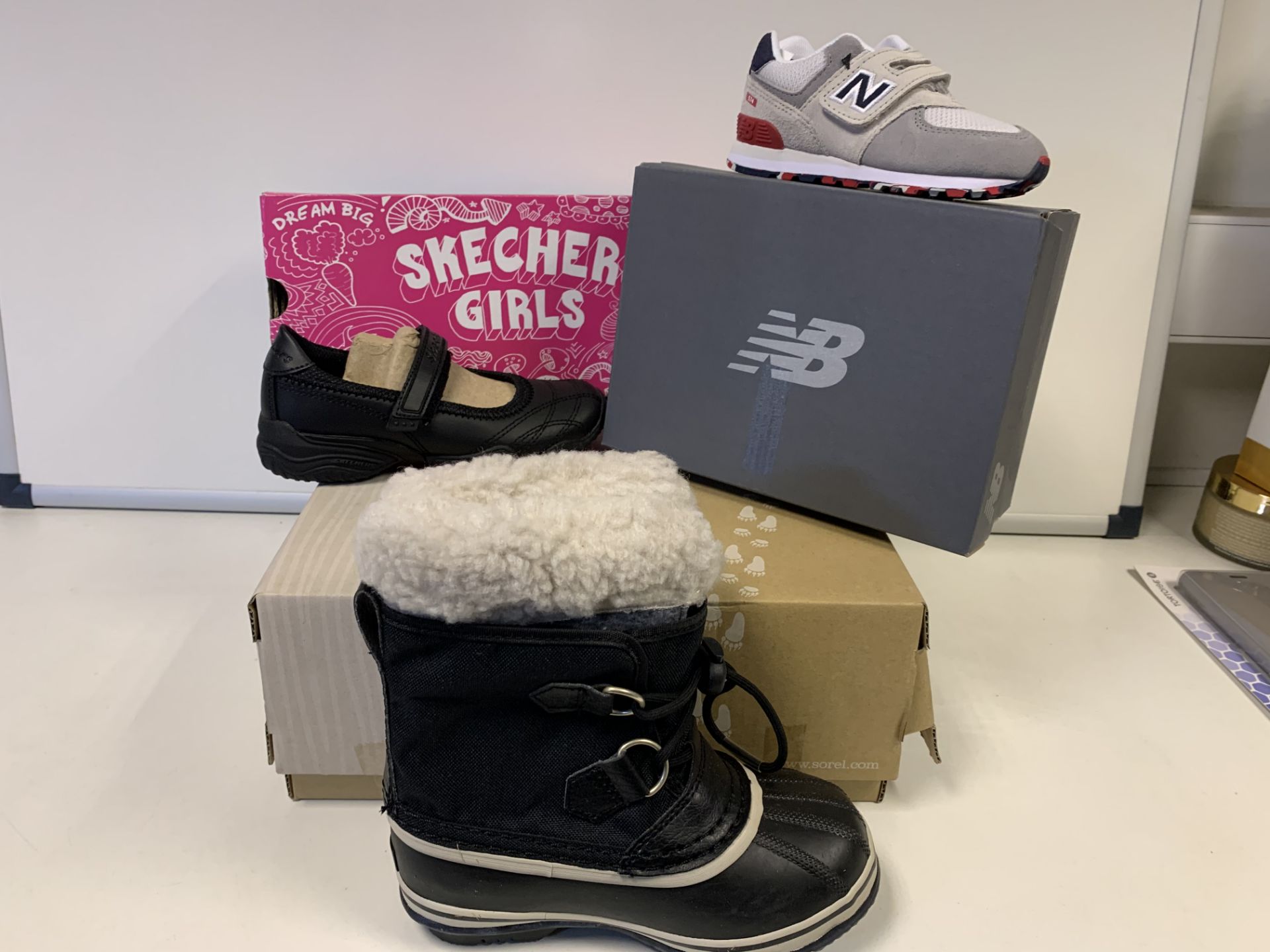 (NO VAT) 1 X SKETCHERS SHOES, 1 X NEW BALANCE TRAINERS, AND 1 X SOREL BOOTS IN VARIOUS SIZES