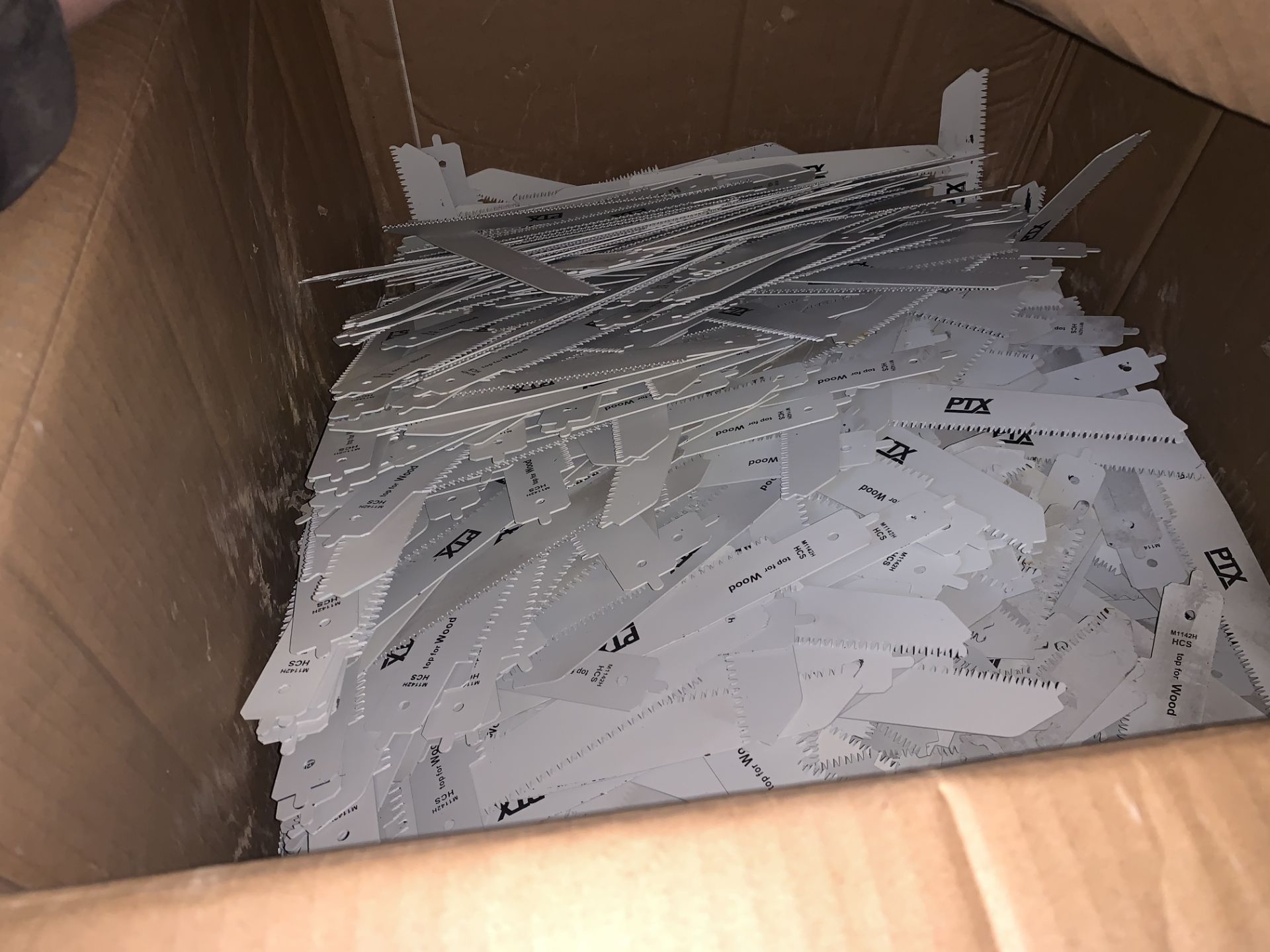 BOX CONTAINIG A LARGE QUANTITY OF PTX WOOD SAW BLADES