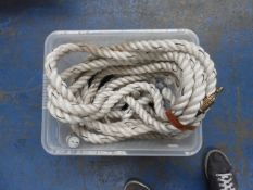 Box containing various lengths of Nylon cordon rope with hooks.