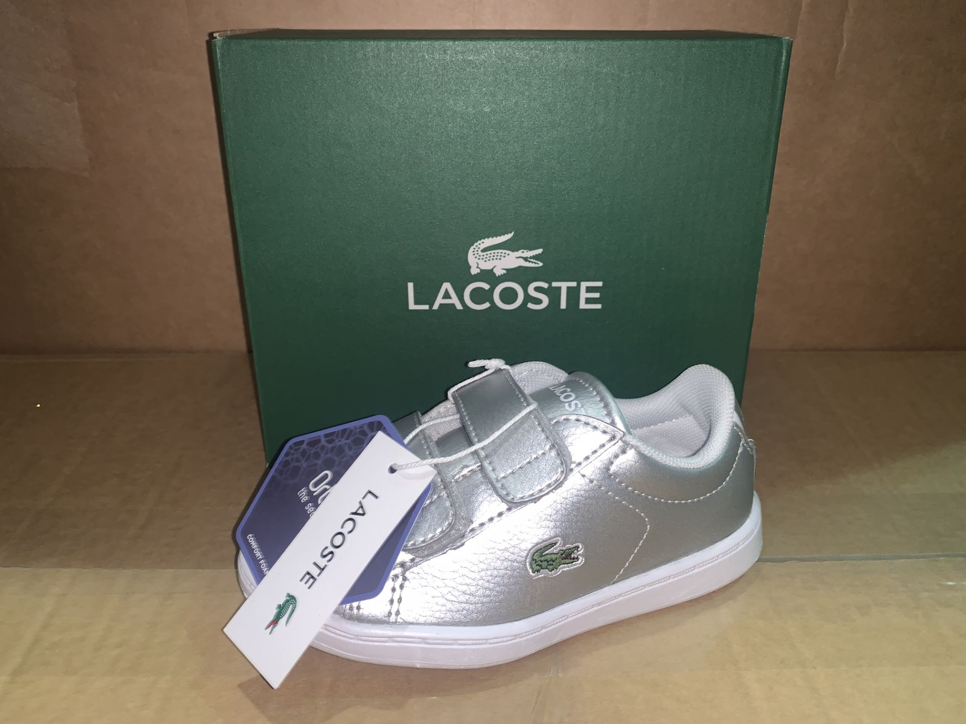 (NO VAT) 3 x NEW BOXED PAIRS OF LACOSTE CARNABY EVO TRAP SILVER TRAINERS. SIZE INFANT 7