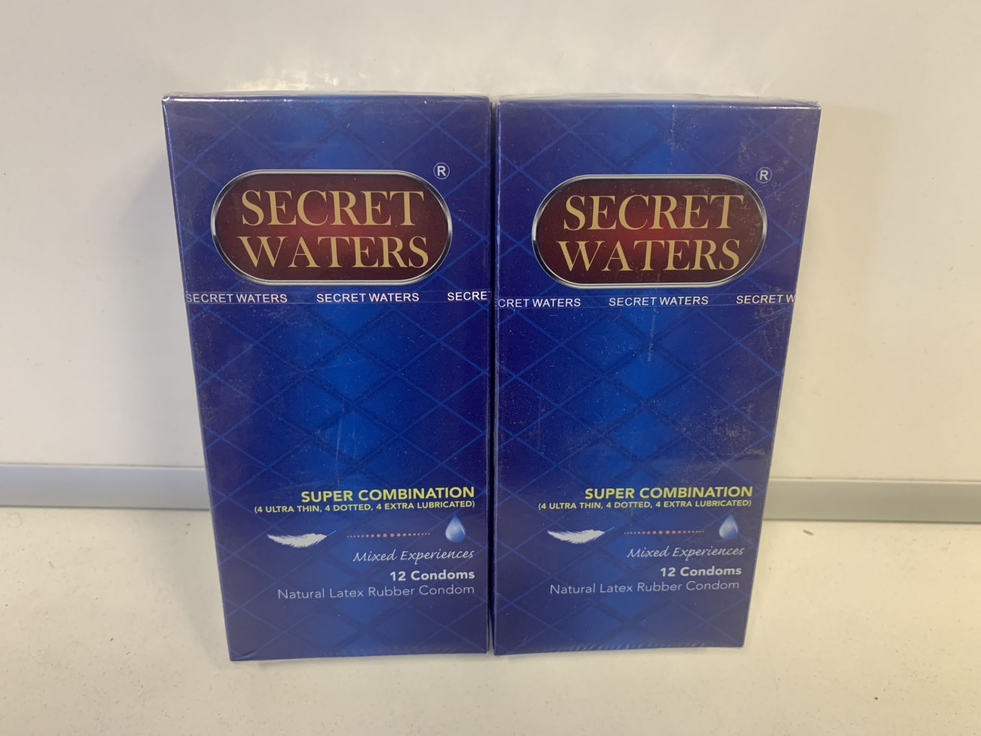 60 X BRAND NEW PACKS OF 12 SECRET WATERS SUPER COMBINATION MIXED EXPERIENCES CONDOMS (1105/30)